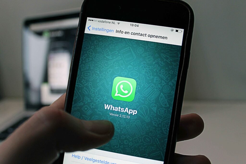 WhatsApp logo on mobile phone screen