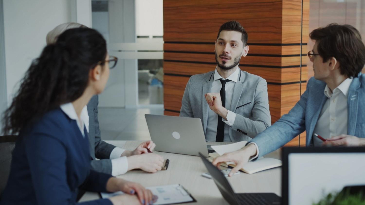 Professional business team collaborating in a modern office meeting