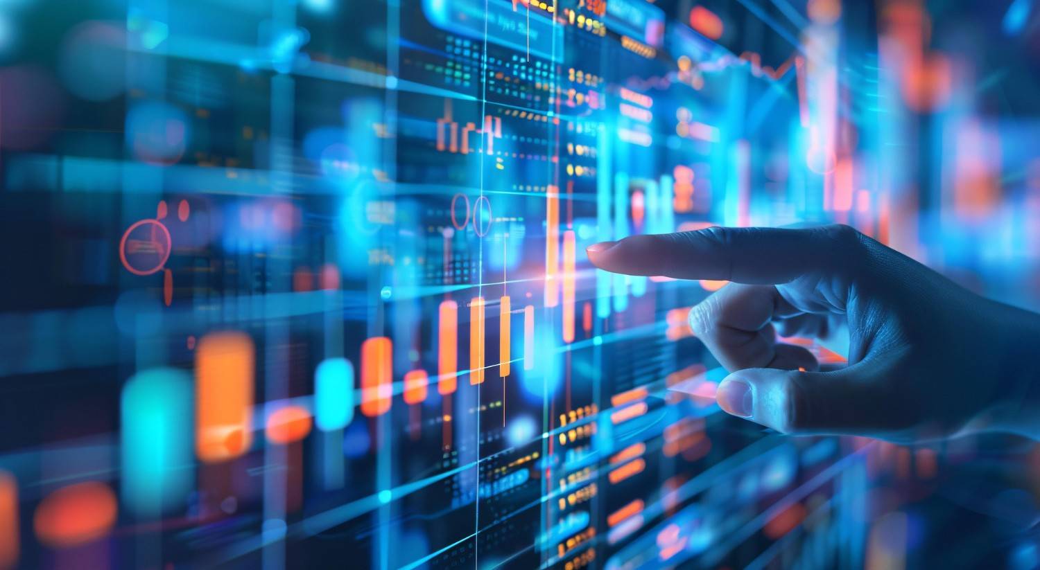 Close-up of a hand touching a glowing screen displaying charts and data visualizations